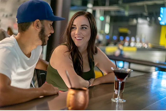 A couple enjoy a drink during a night out at Overdrive Sports Bar