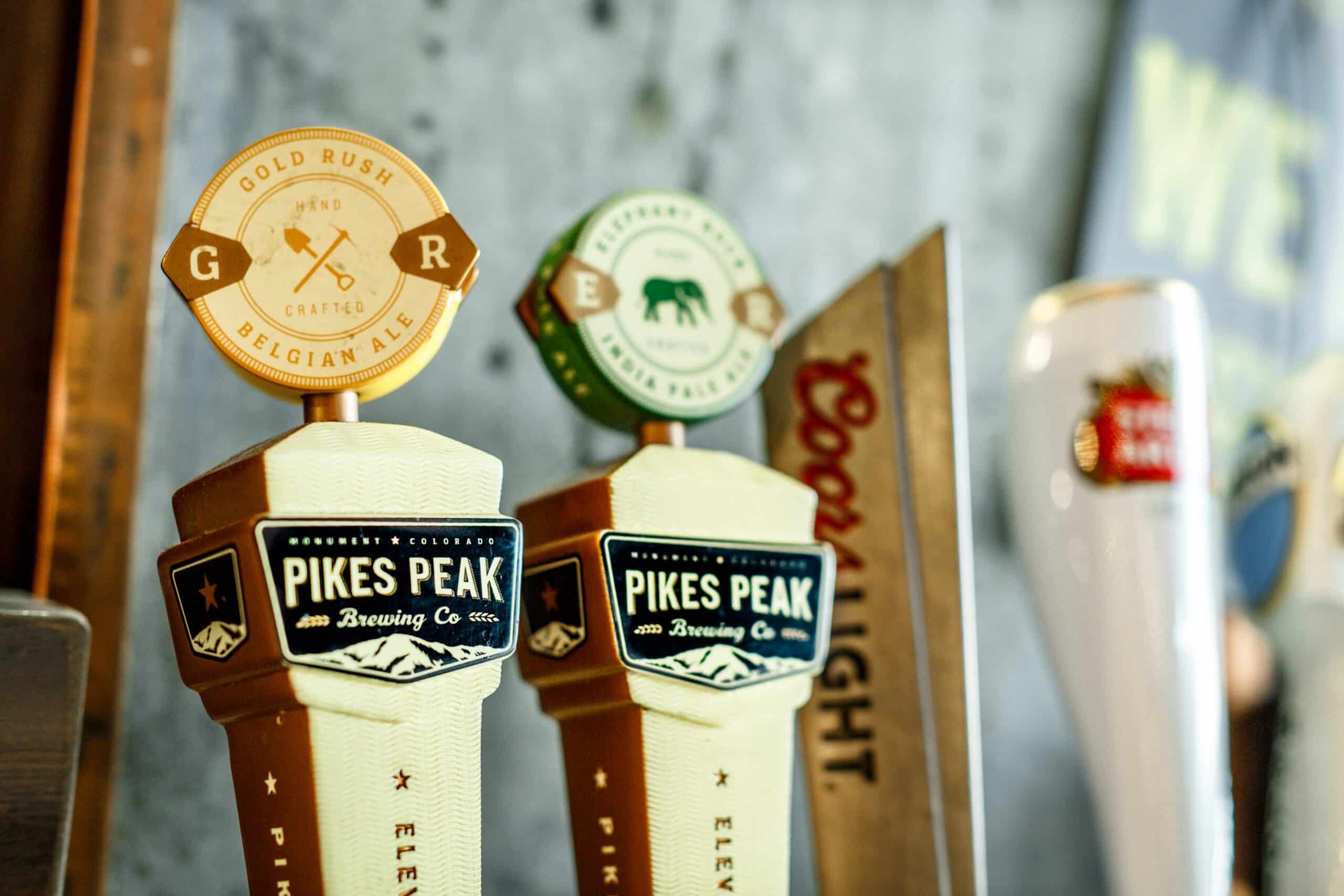 photo of beer taps at a bar for Pikes Peak brewing